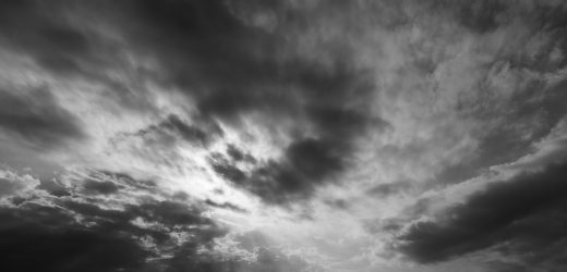 Light breaking through storm clouds symbolizing courage and clarity from keynote speaker on leadership and courage Ryan Berman